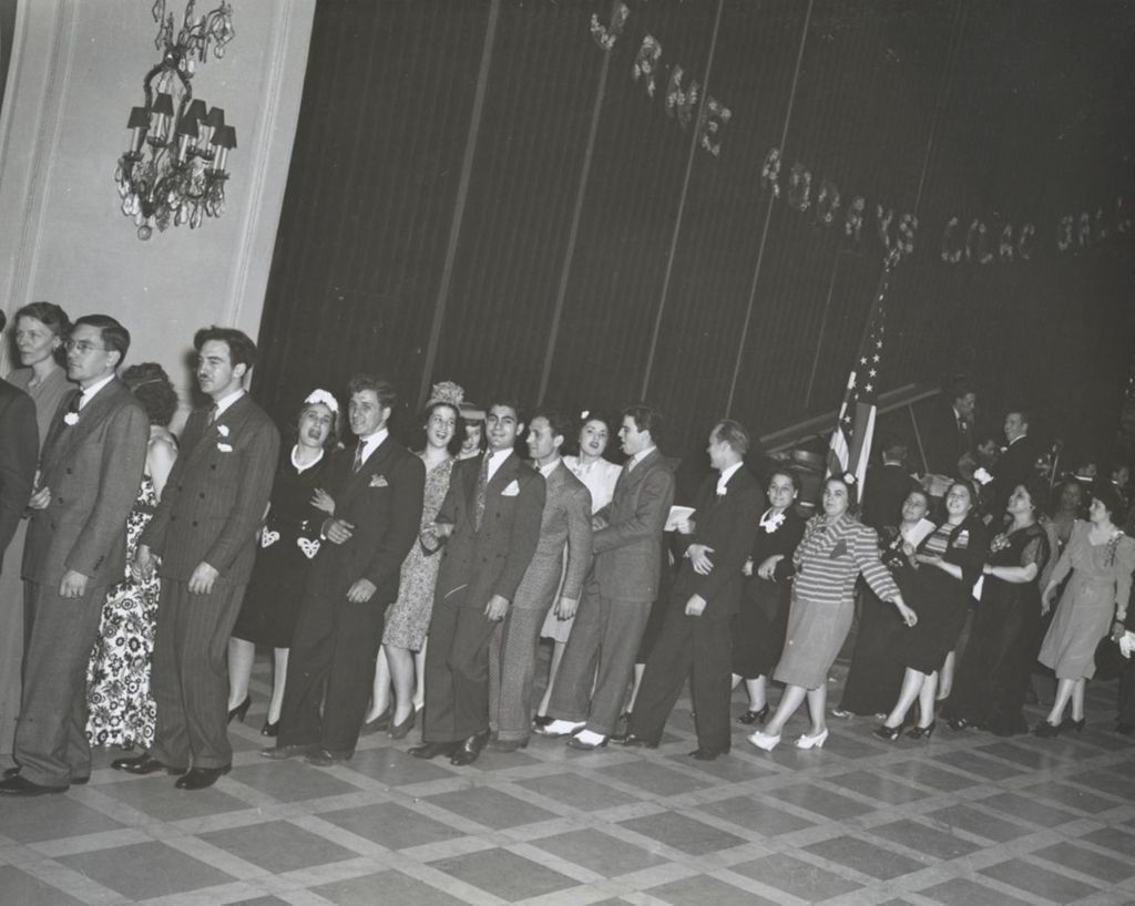 Miniature of Pairs of attendees in a line at the 1941 Lilac Ball at the Stevens Hotel