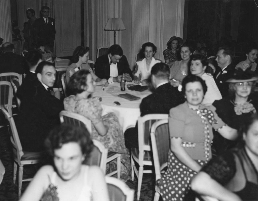 Attendees seated around tables at the 1941 Lilac Ball at the Stevens Hotel