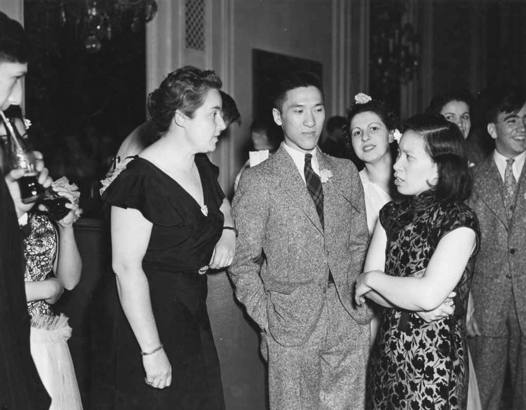 Attendees mingling at the 1941 Lilac Ball at the Stevens Hotel