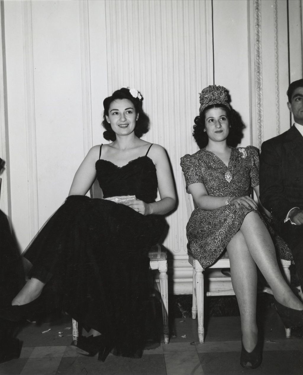 Attendees seated against the wall at the 1941 Lilac Ball at the Stevens Hotel