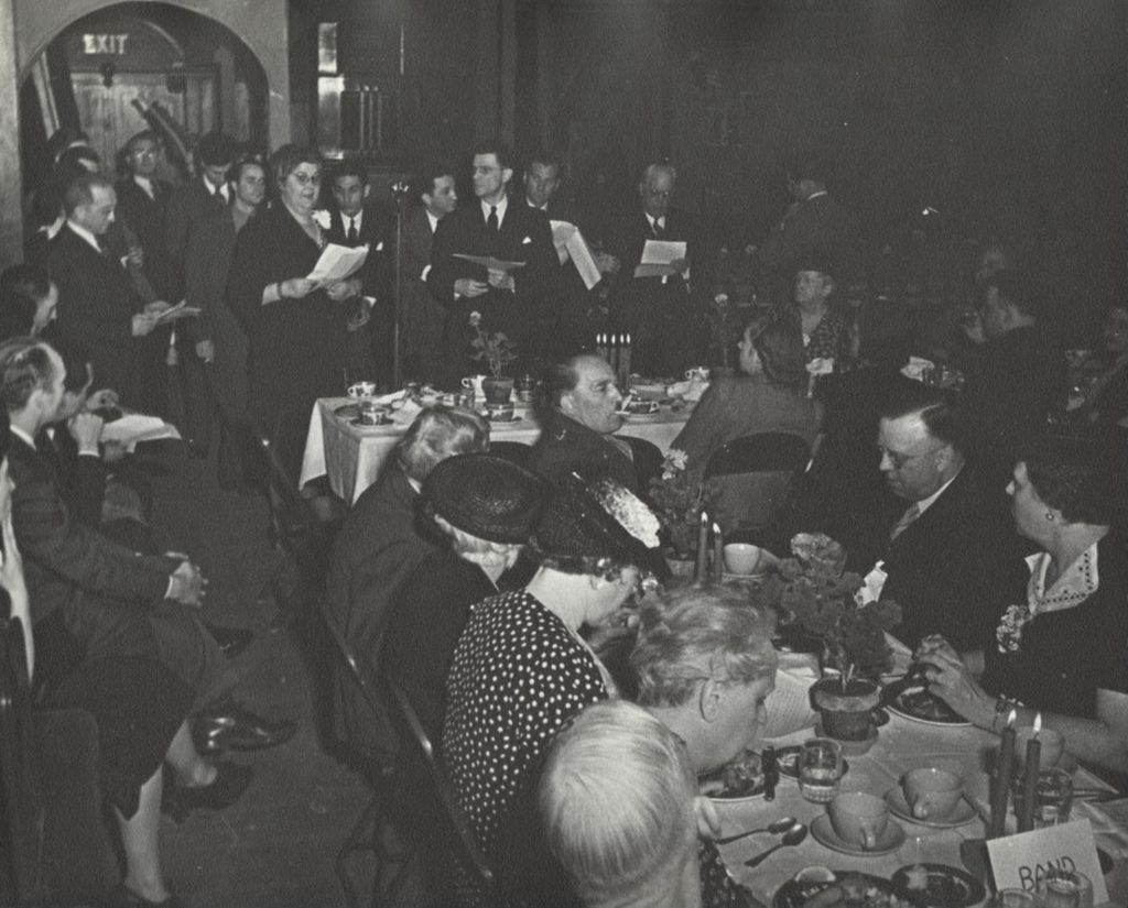 Miniature of Hull-House director Charlotte Carr addressing the audience at the 1940 Alumni Dinner, part of the 50th Anniversary celebration