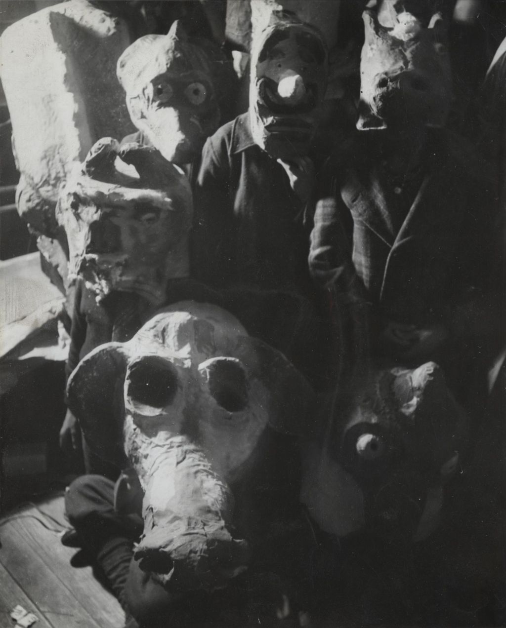 Children wearing papier-mache animal masks created for Hull-House 50th Anniversary circus