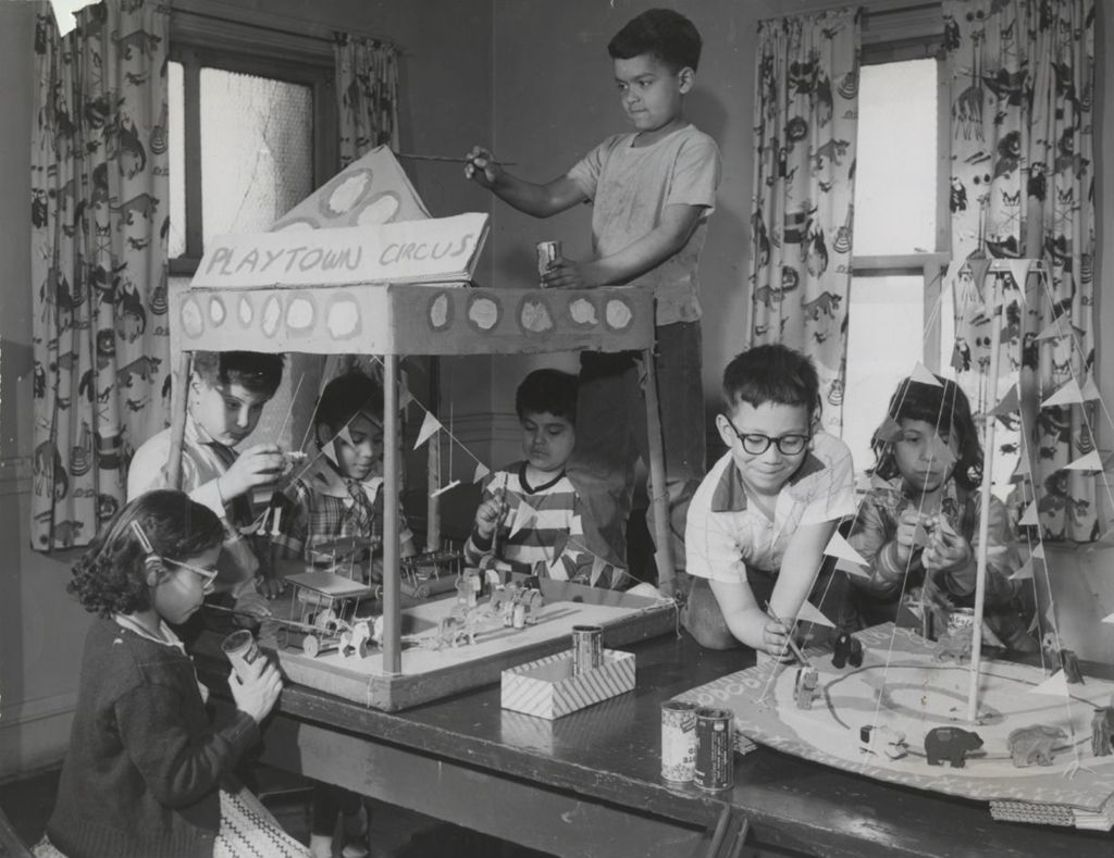 Miniature of Children at Hull-House working on large models of circuses