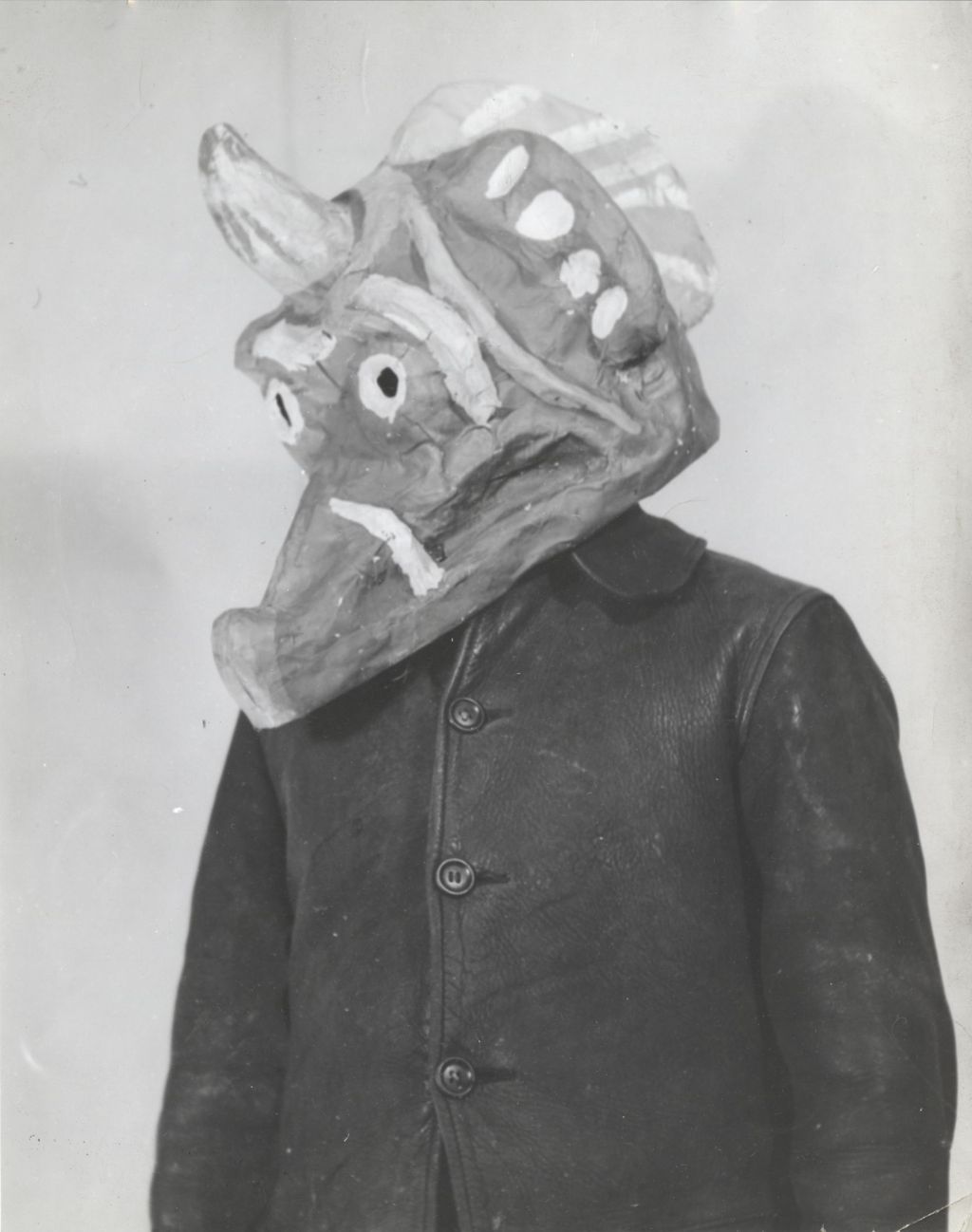Person wearing papier-mache animal mask created for Hull-House 50th Anniversary circus