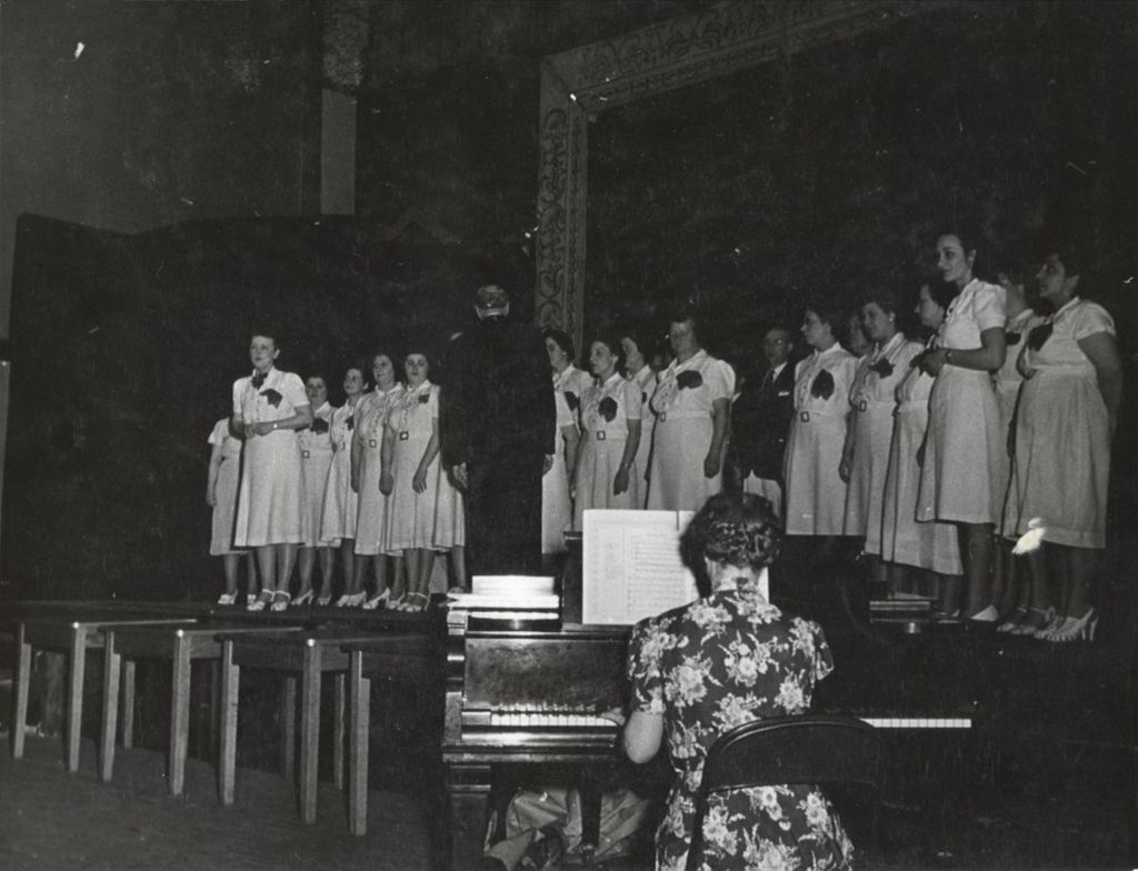 Singing group on stage at Hull-House