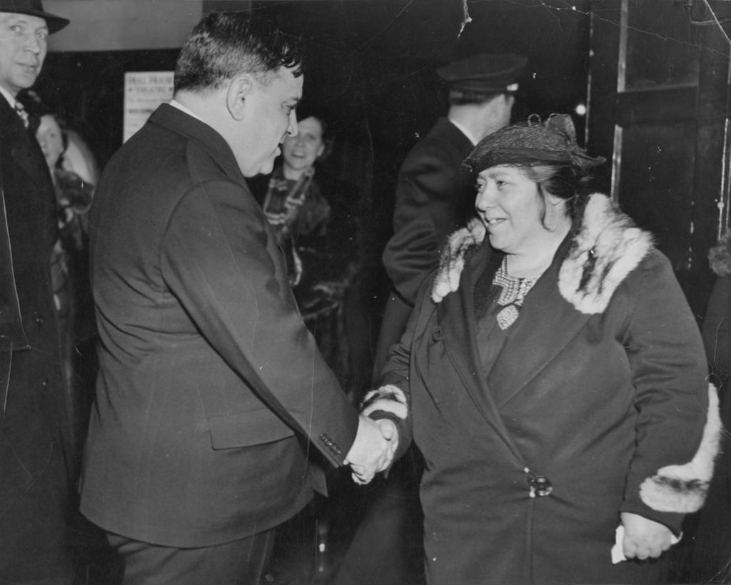 Miniature of New York Mayor Fiorello La Guardia shakes hands with woman at Hull-House