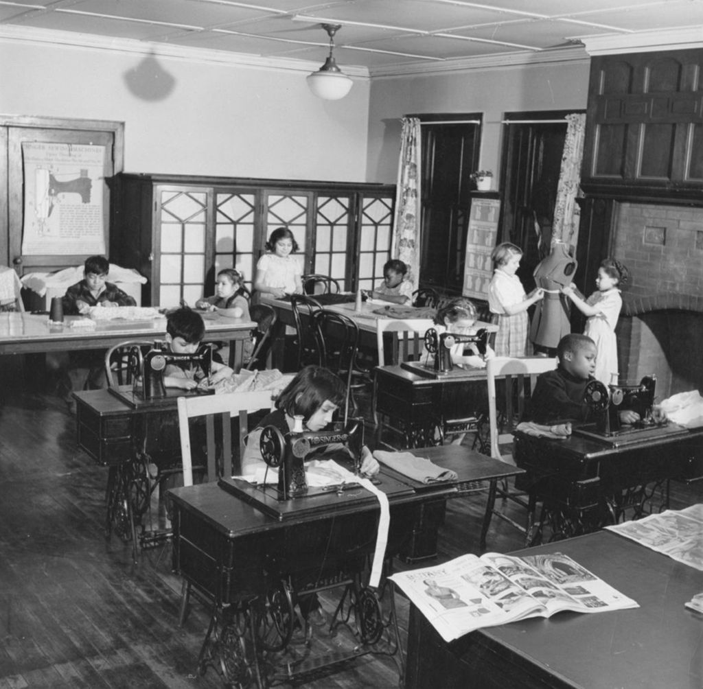Young people in a sewing class at Hull-House