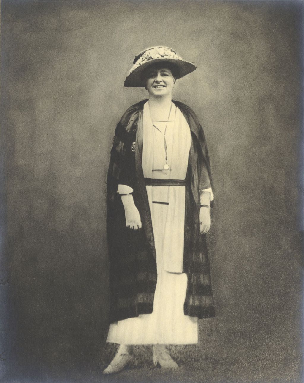 Miniature of Woman standing wearing hat