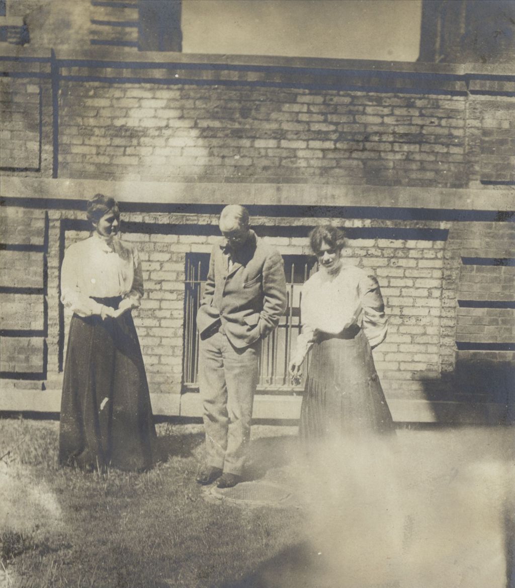 Miniature of Three Hull-House residents standing in the courtyard below the Residents' Dining Hall terrace