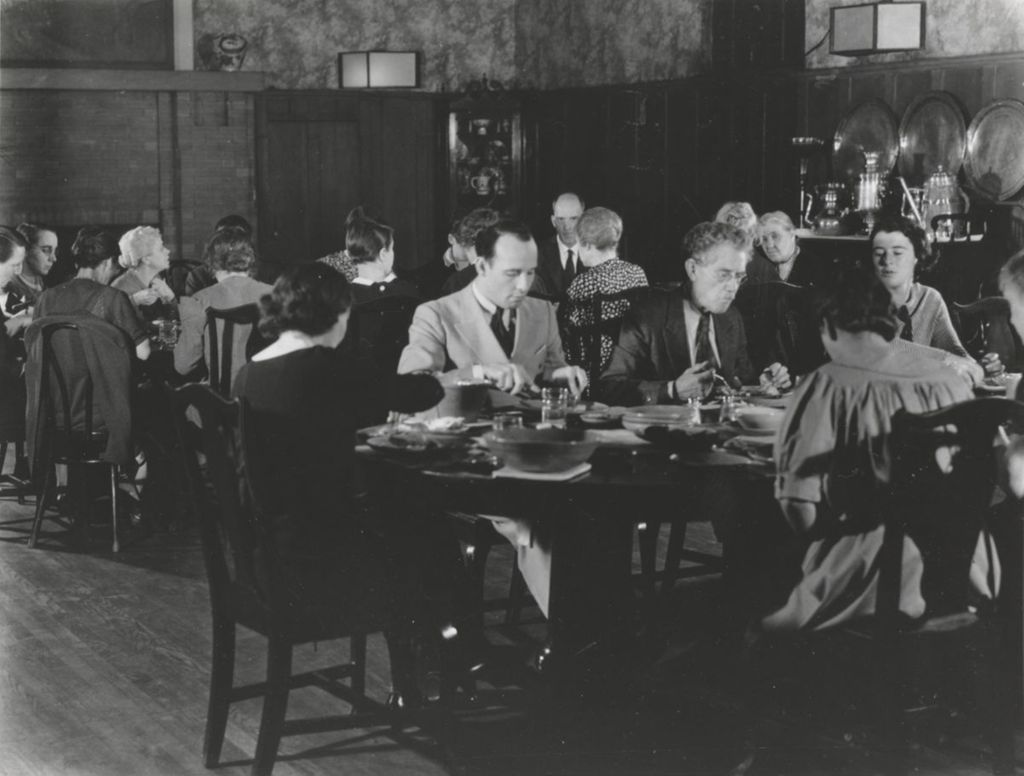 Miniature of Hull-House co-founder and head resident Jane Addams and other Hull-House residents dining in the Residents' Dining Hall