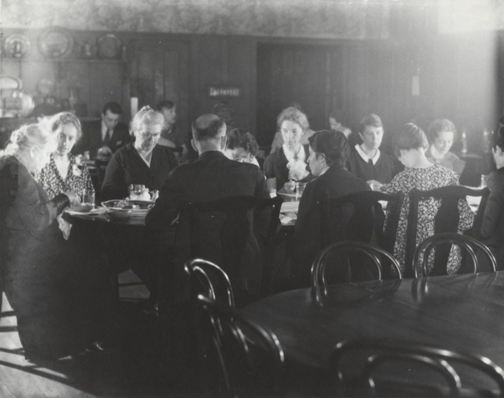 Hull-House co-founder and head resident Jane Addams and other Hull-House residents dining in the Residents' Dining Hall