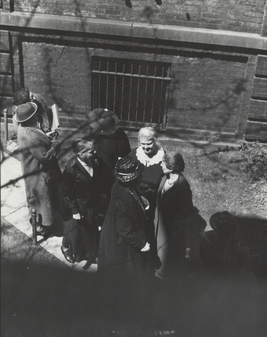 Miniature of Dr. Alice Hamilton, Ida Mott-Smith Lovett, Jessie Binford, and other women in Hull-House courtyard