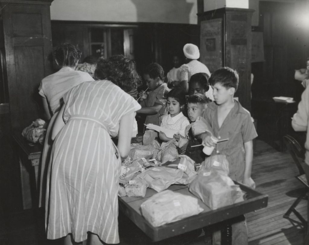 Summer play group participants in line for food at Hull-House
