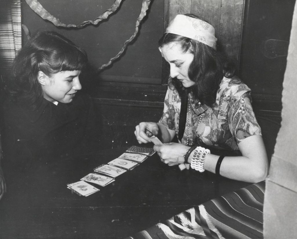 Miniature of Woman and girl at a table with playing cards in Hull-House game room