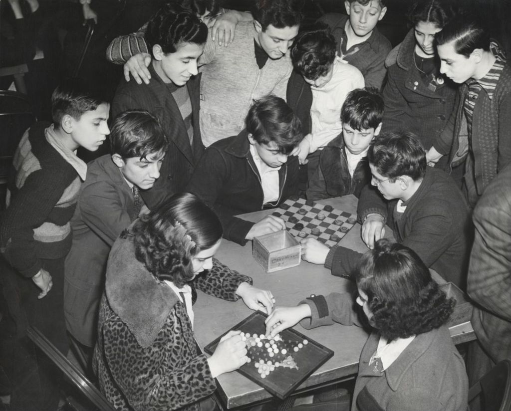 Young people at Hull-House Girls and Boys Club playing checkers and Chinese checkers
