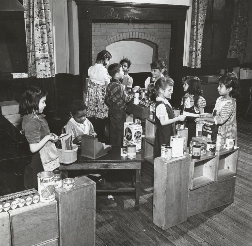 Young children in a Hull-House playgroup "grocery store"