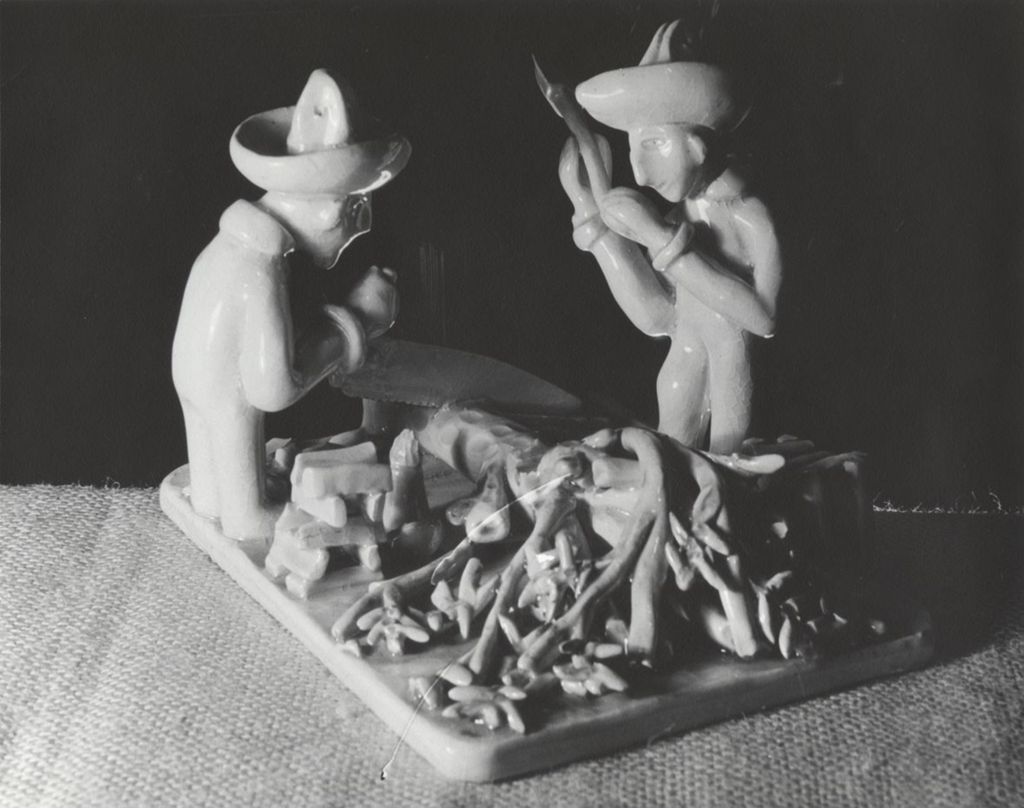Ceramic sculpture of two wood cutters wearing sombreros