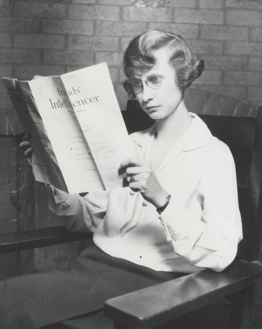 Miniature of Hull-House secretary Mrs. Stetson reading Friends' Intelligencer