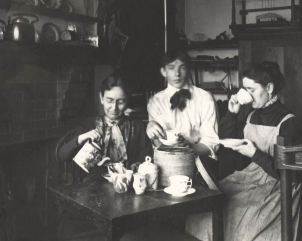 Ellen Gates Starr, her bookbinding pupil Peter Verburg, and Jane Addams having tea in the bookbindery in the Hull-House Labor Museum