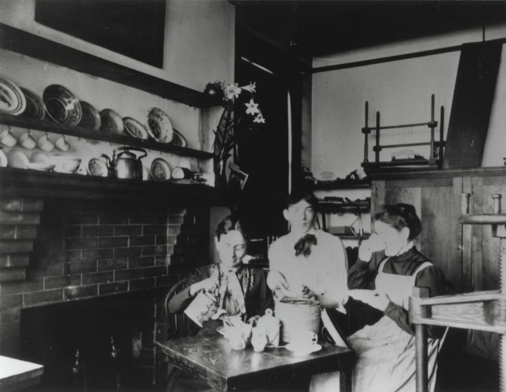Miniature of Hull-House co-founders Ellen Gates Starr and Jane Addams having tea with Peter Verburg in the Labor Museum