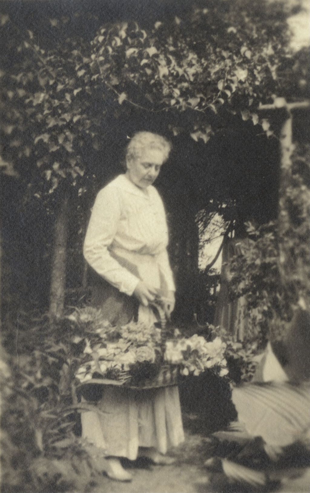 Miniature of Mary Rozet Smith holding a basket of flowers at Bowen Country Club