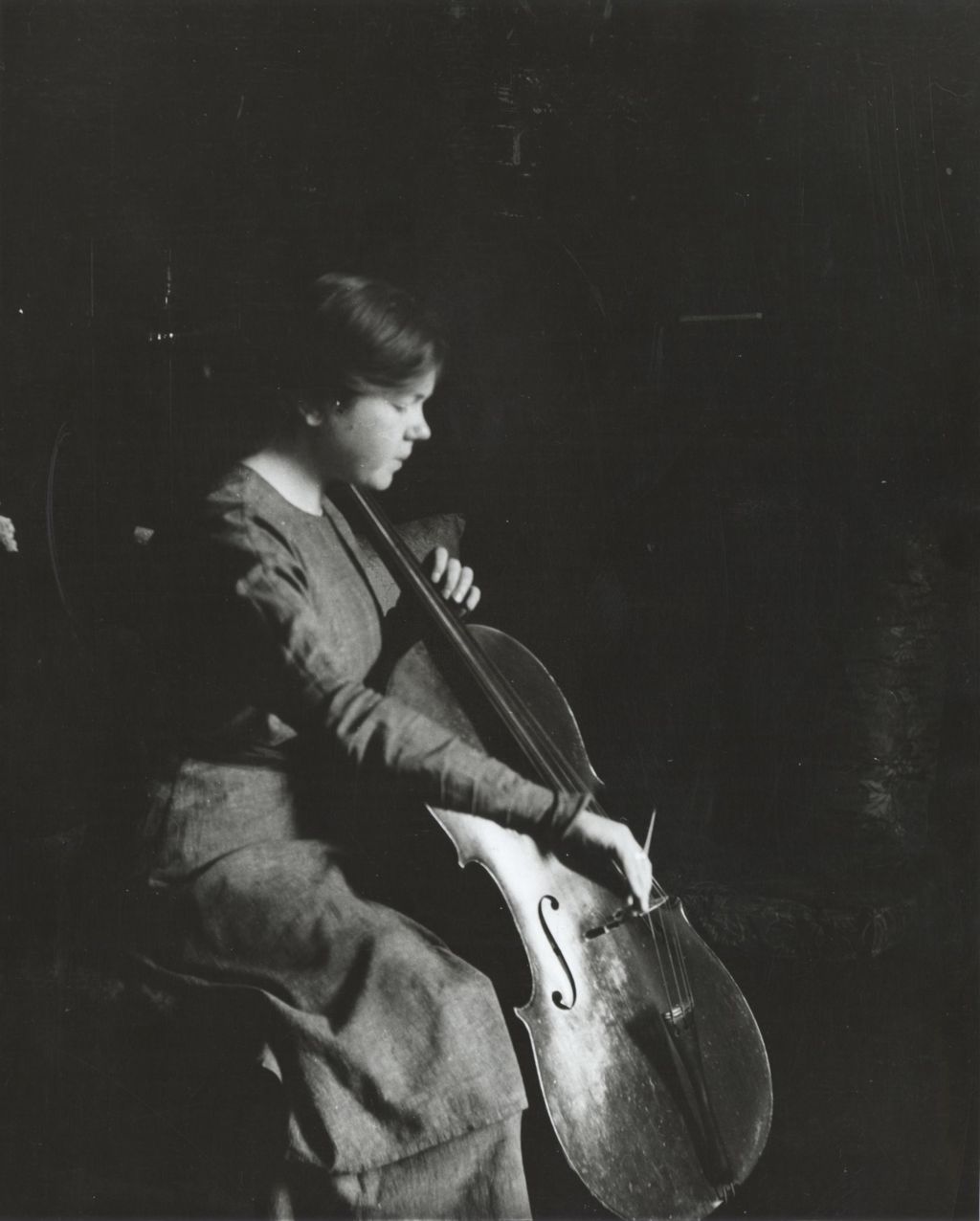 Miniature of Hull-House resident and cellist Vera Poppe playing the cello