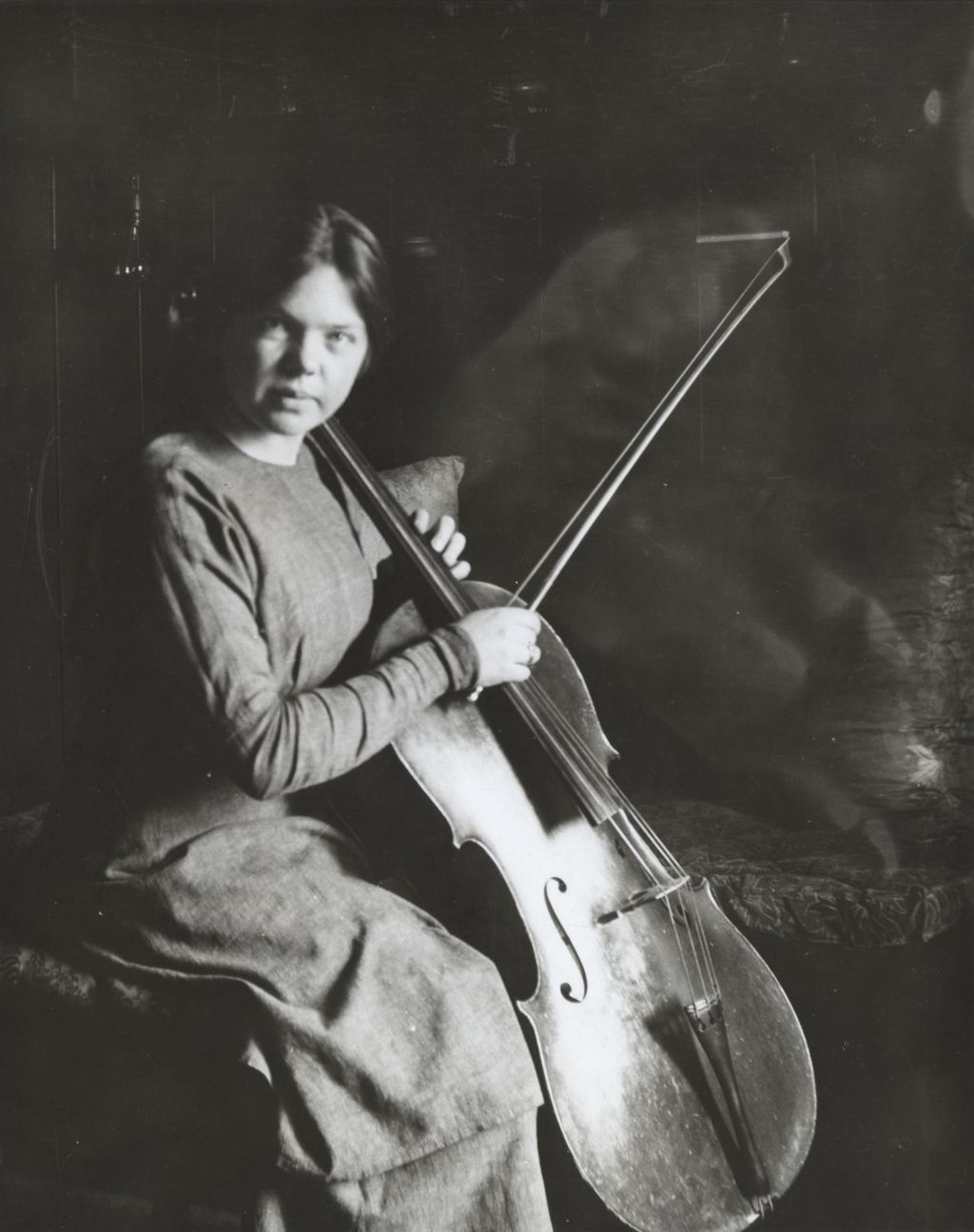 Miniature of Hull-House resident and cellist Vera Poppe holding a cello