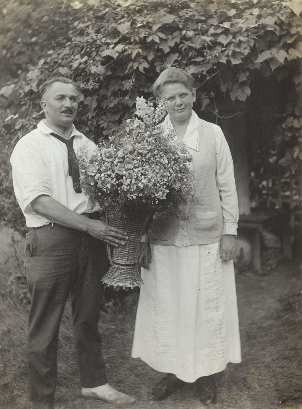 Miniature of James Sylvester and Thora Lund with a basket of flowers from the Hull-House Boys Band
