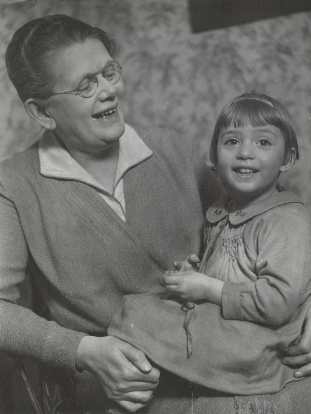 Miniature of Thora Lund with a young girl on her lap