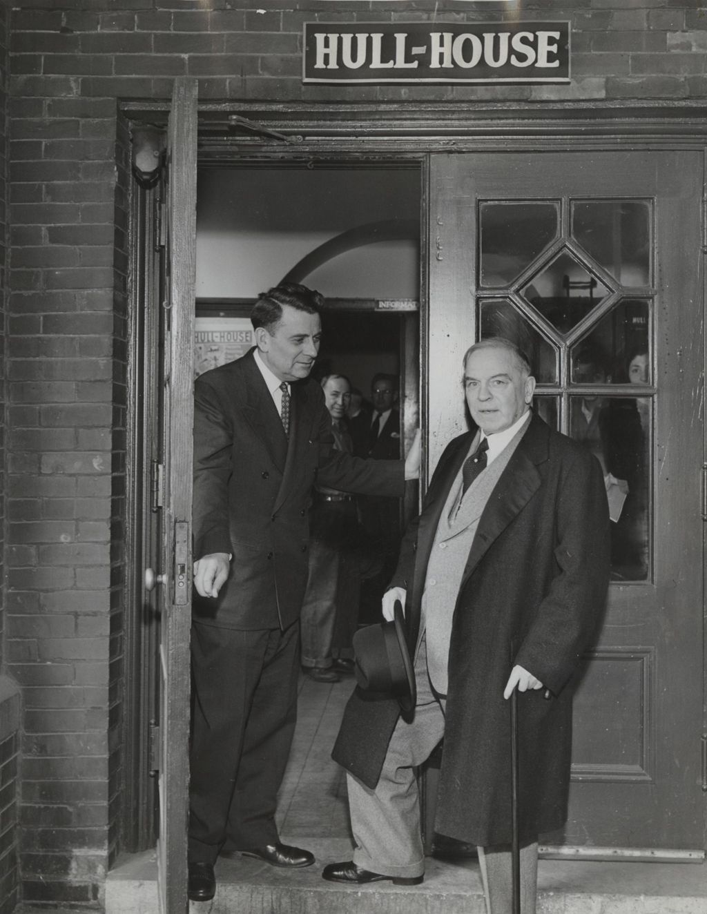Canadian Prime Minister and former Hull-House resident W. L. Mackenzie King at the entrance of Hull-House