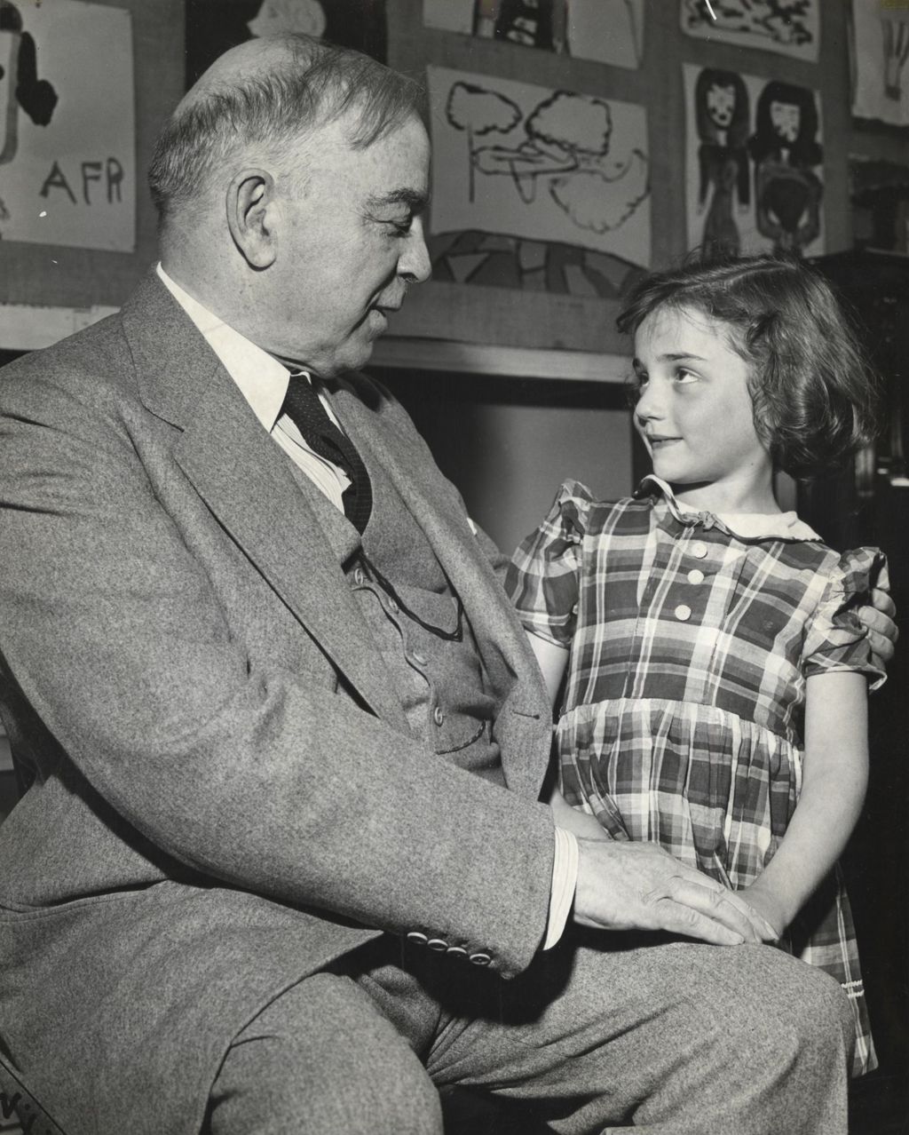 Canadian Prime Minister and former Hull-House resident W. L. Mackenzie King talking to a girl at Hull-House