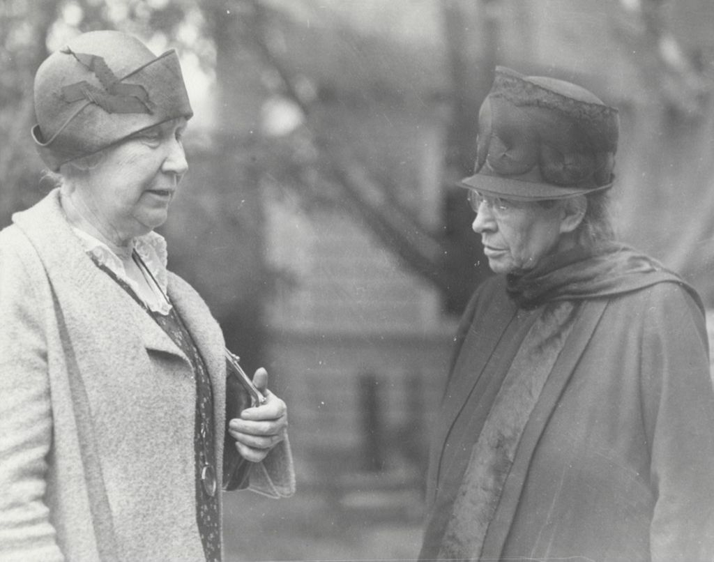 Miniature of Former Hull-House resident Florence Kelley talking to a woman at the Bowen Country Club during the Hull-House 40th anniversary celebration