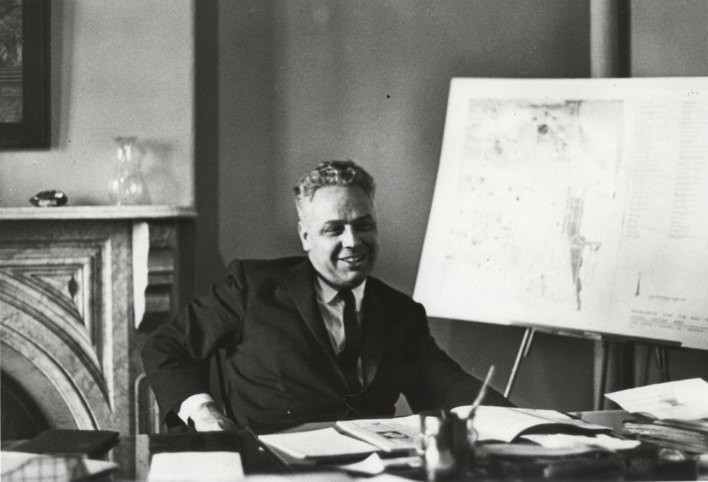 Hull-House executive director Paul Jans sitting at his desk