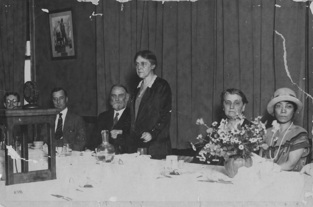 Dr. Alice Hamilton, physician and Hull-House resident, speaking at a banquet with Jane Addams at the head table