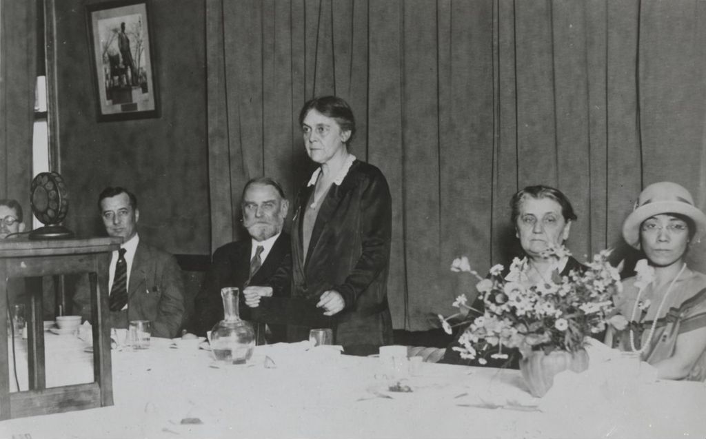 Miniature of Dr. Alice Hamilton, physician and Hull-House resident, speaking at a banquet with Jane Addams at the head table