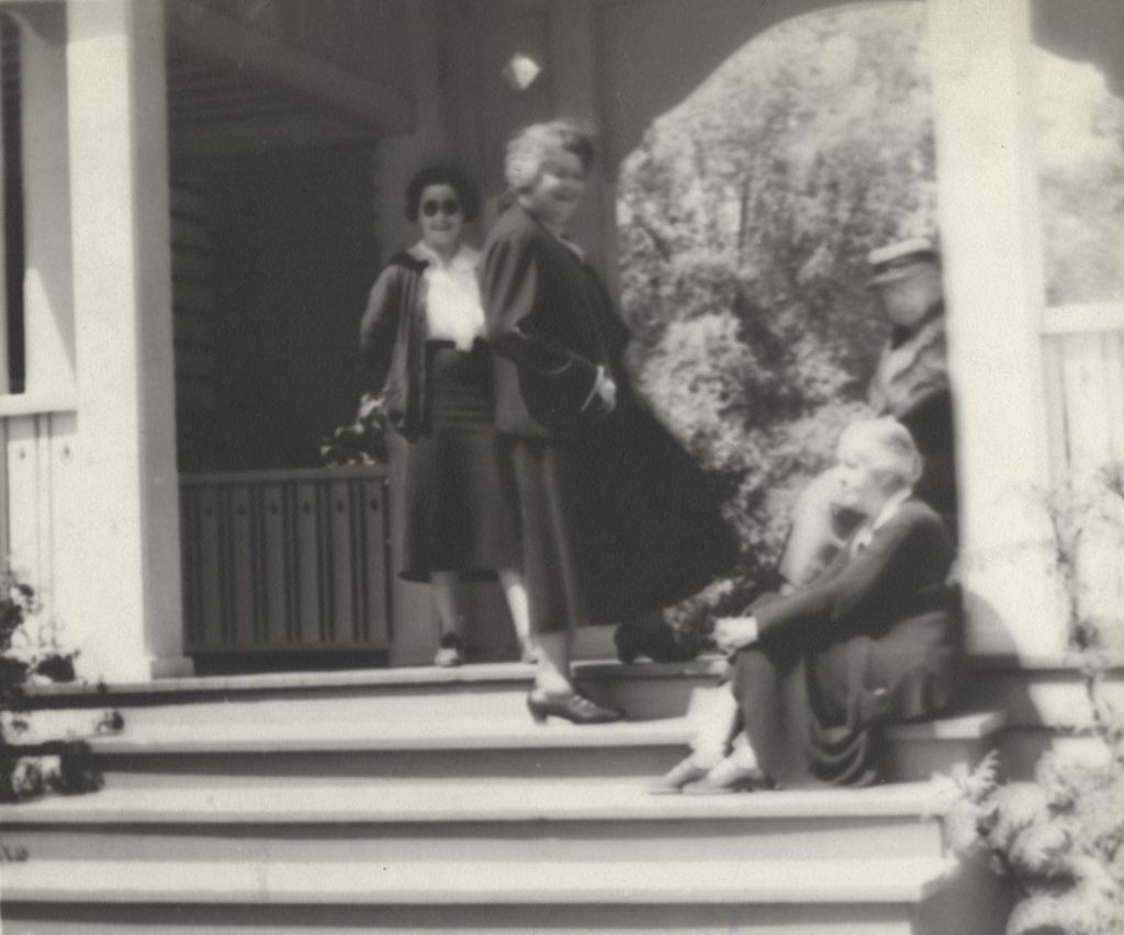 Charlotte Carr, Louise de Koven Bowen, Dr. Alice Hamilton, and an unidentified woman in a covered entryway at Bowen Country Club during a Block Party