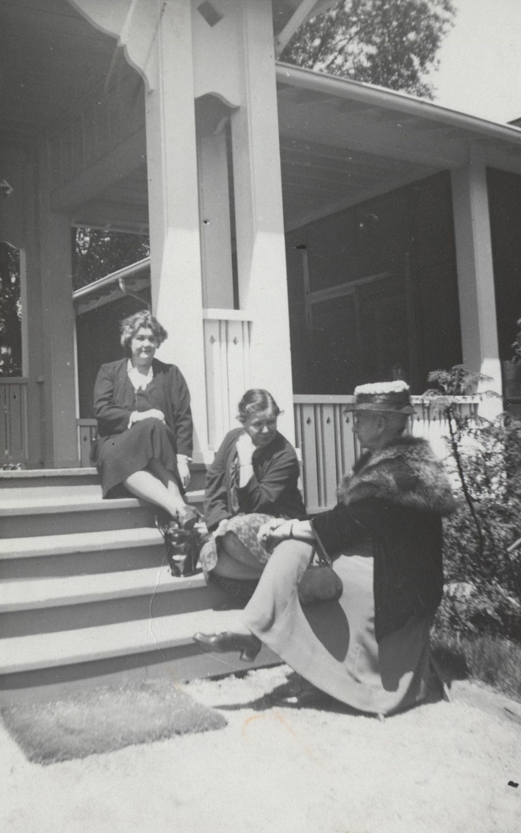 Charlotte Carr, Louise de Koven Bowen, and Miss Dickerson sitting outside at Bowen Country Club during a Block Party
