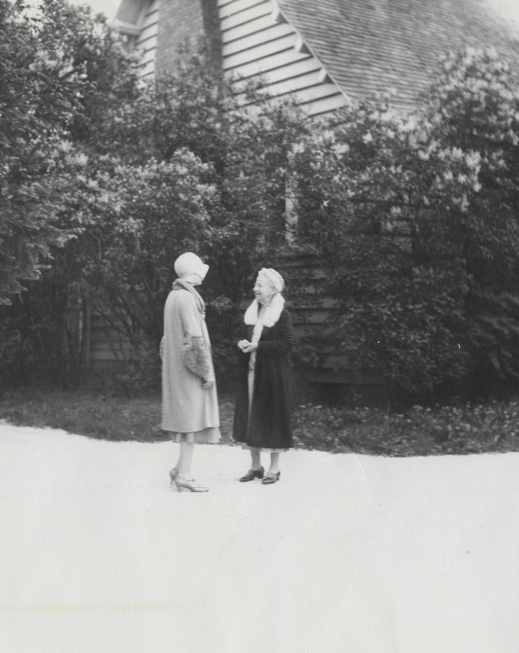Miniature of Louise de Koven Bowen chatting with a friend in front of her cottage at Bowen Country Club