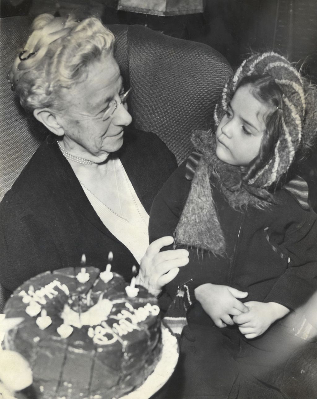 Louise de Koven Bowen with a young girl on her lap
