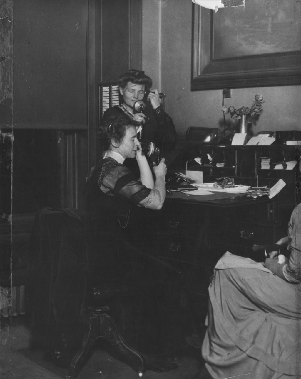 Residents Ethel Dewey and Jessie Binford working the telephones at Hull-House