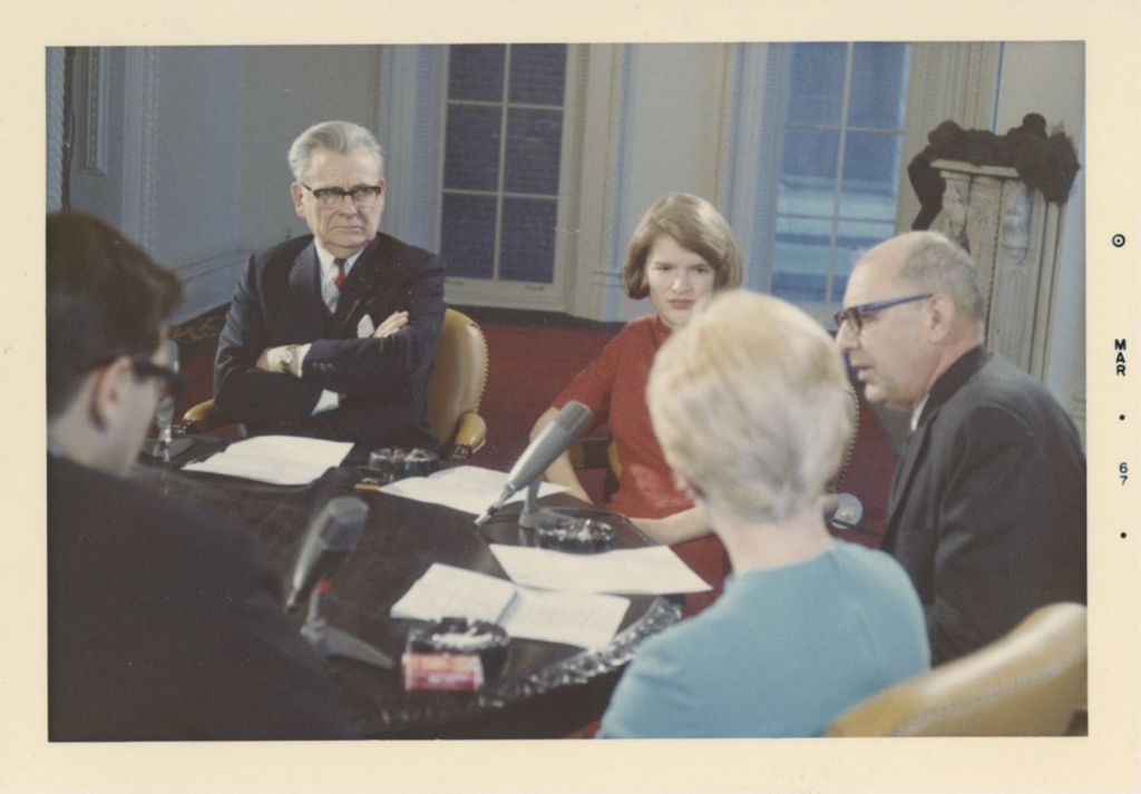 Russell W. Ballard and others in a meeting in Hull Mansion