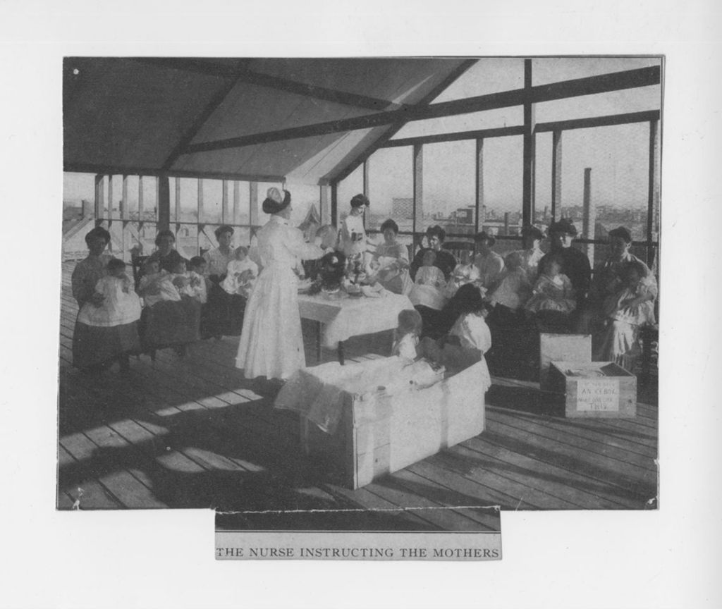 Nurse instructing mothers on roof of Mary Crane Nursery