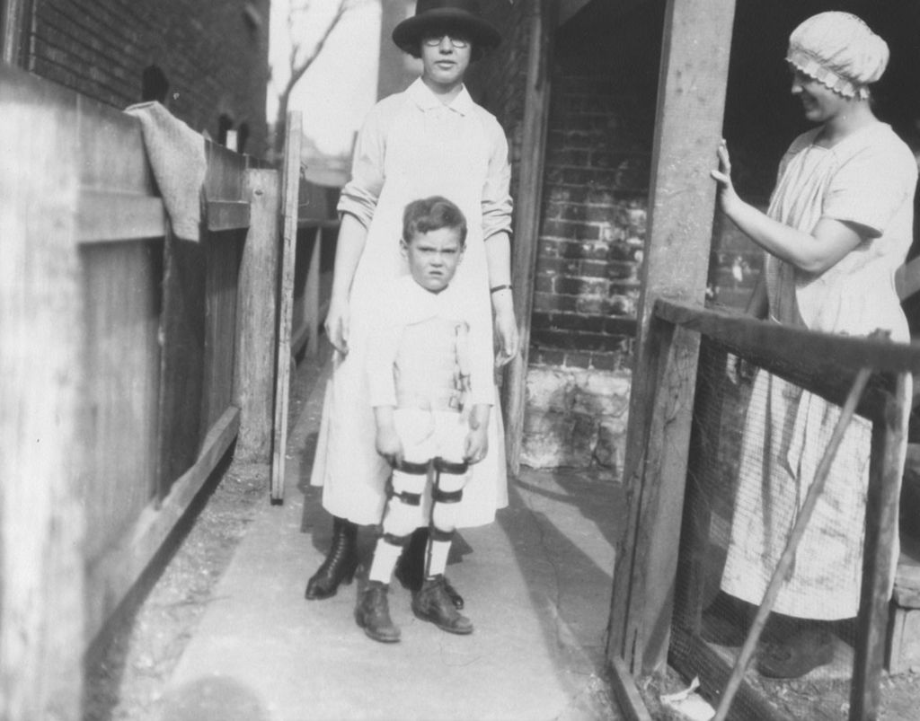 Miniature of Boy with leg braces and visiting nurses