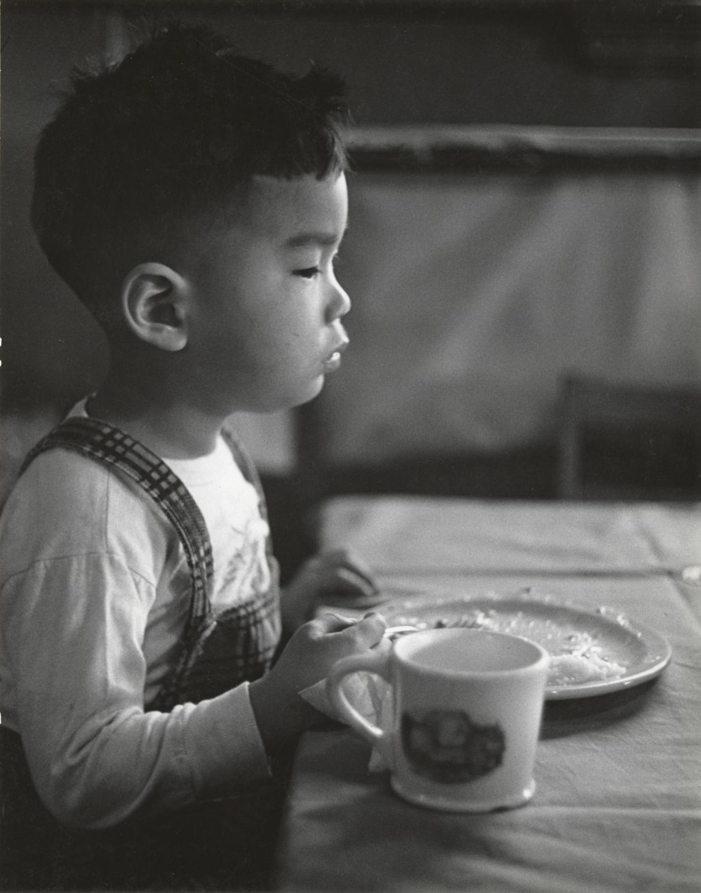 Miniature of Boy finishing plate of food at Mary Crane Nursery