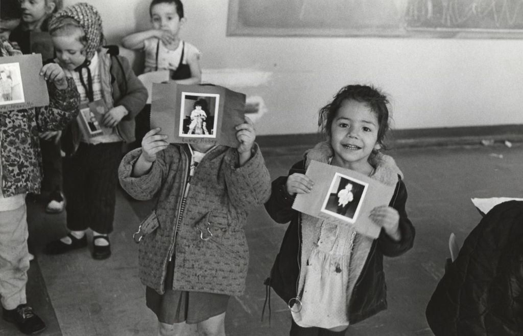 Miniature of Children at Mary Crane Nursery holding up photos attached to cards