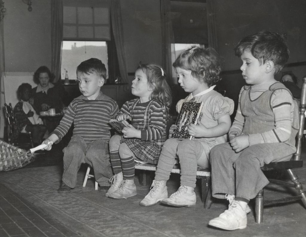 Miniature of Four children at Mary Crane Nursery, one roasting marshmallows