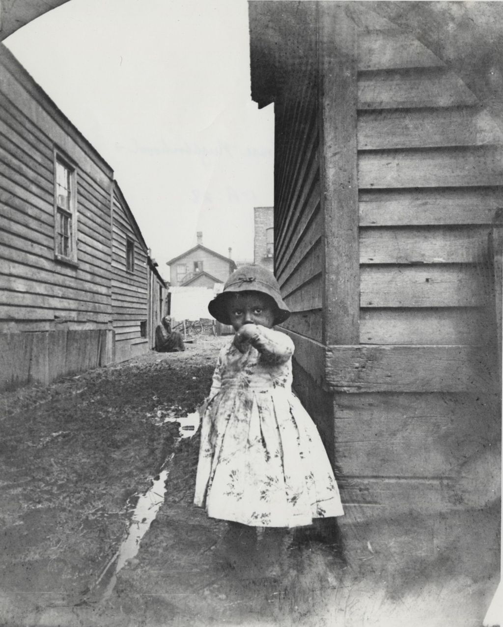 Miniature of Young girl in an alley in a neighborhood near Hull-House