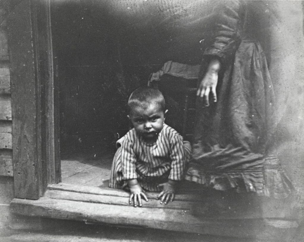 Miniature of Young child in doorway in neighborhood near Hull-House