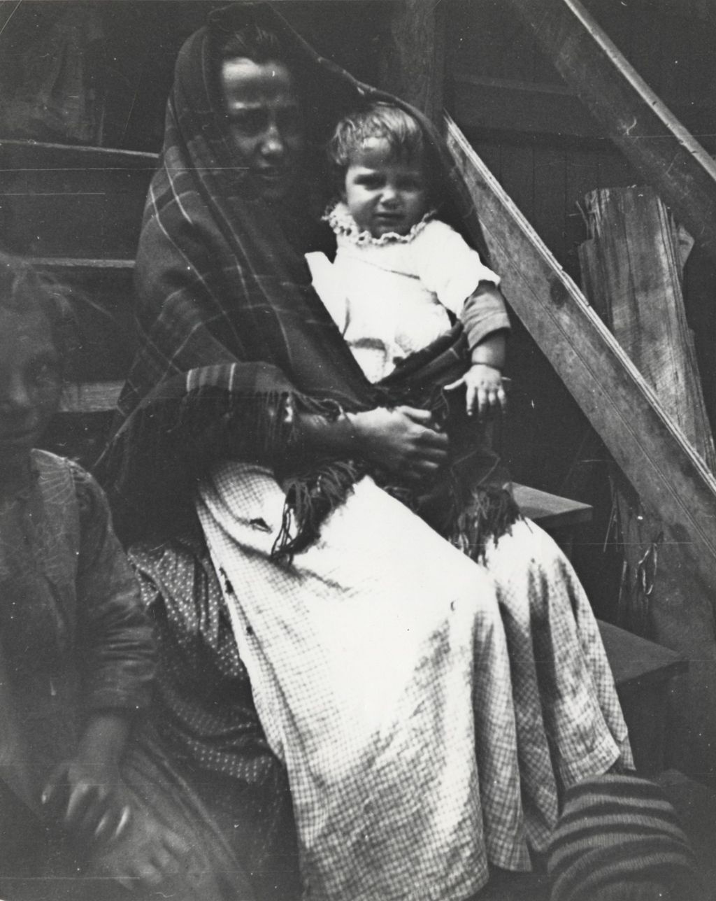 Miniature of A woman and small child sitting on a staircase in neighborhood near Hull-House