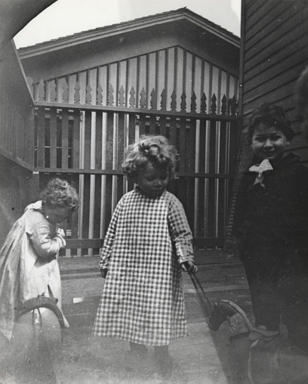 Miniature of Three children on a wooden deck in neighborhood near Hull-House